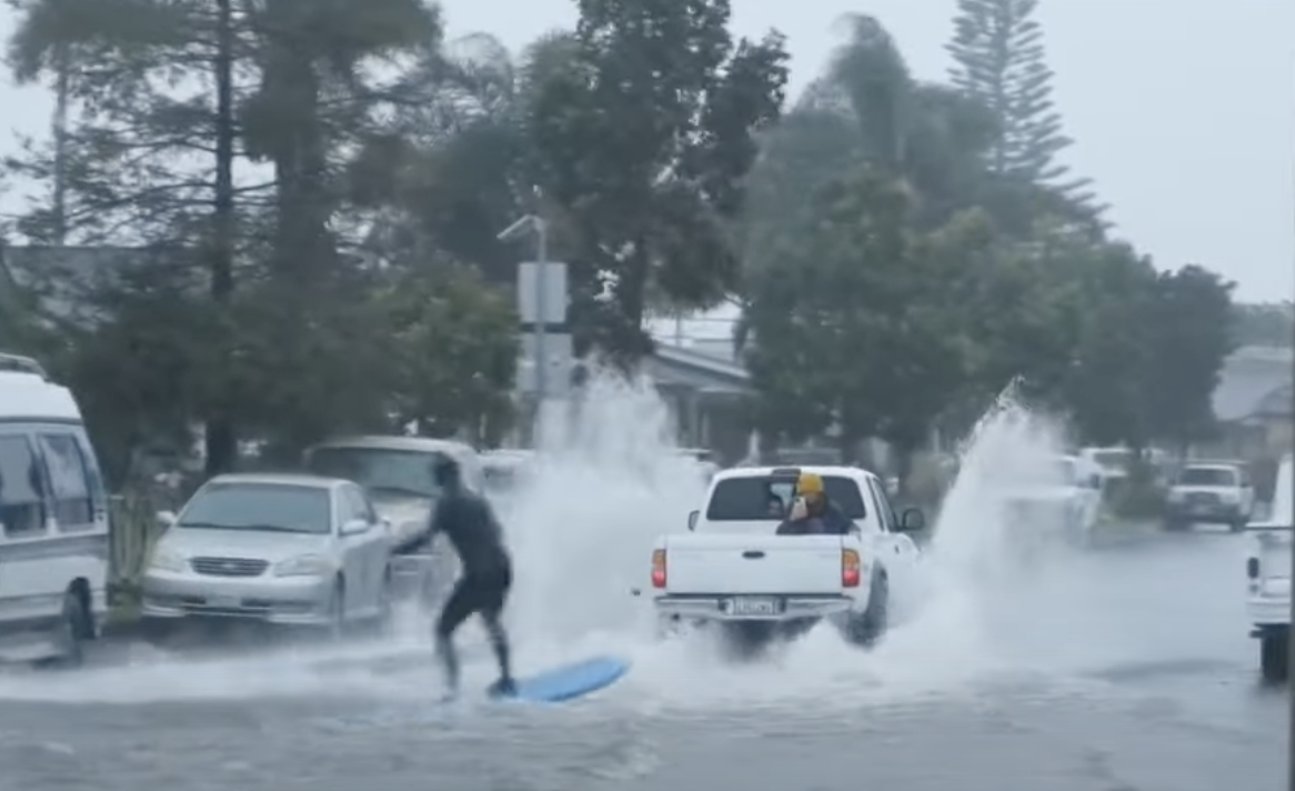 Man is pulled behind a Toyota.